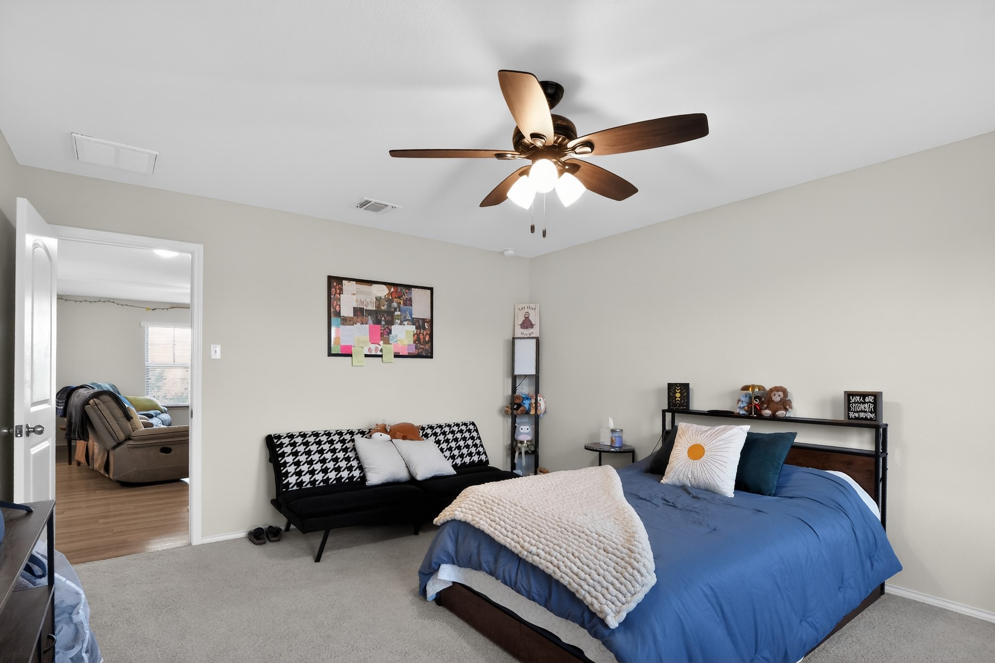 521 Staton Street Georgetown, TX 78626 - Photo 19 of 39 a bedroom with a bed and a ceiling fan