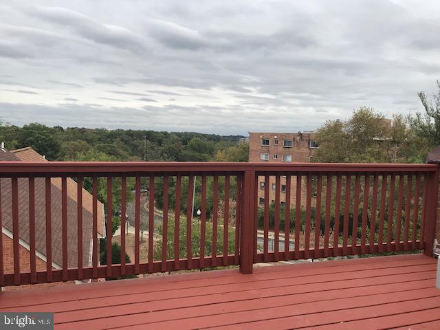 4911 7th Road South, Unit 4911 Arlington, VA 22204 - Photo 11 of 21 a view of balcony with wooden floor and fence