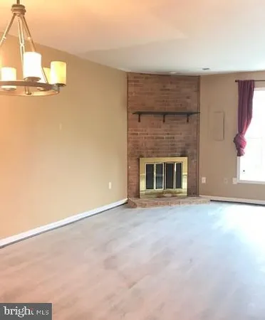 an empty room with fireplace