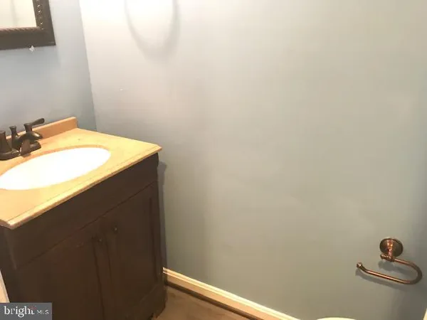 a bathroom with a sink and vanity