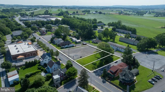 an aerial view of a house with a garden