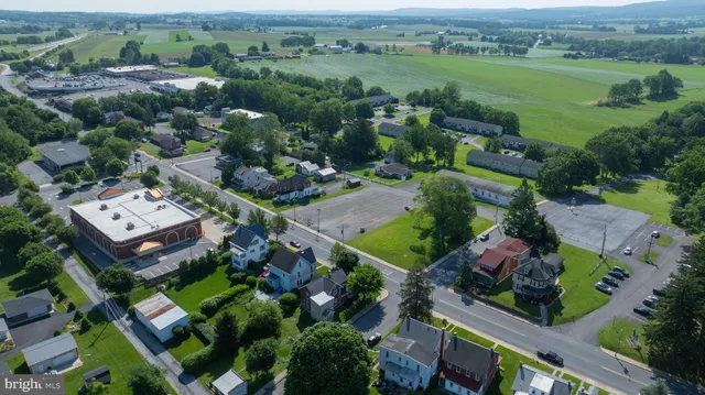 an aerial view of a house with a garden