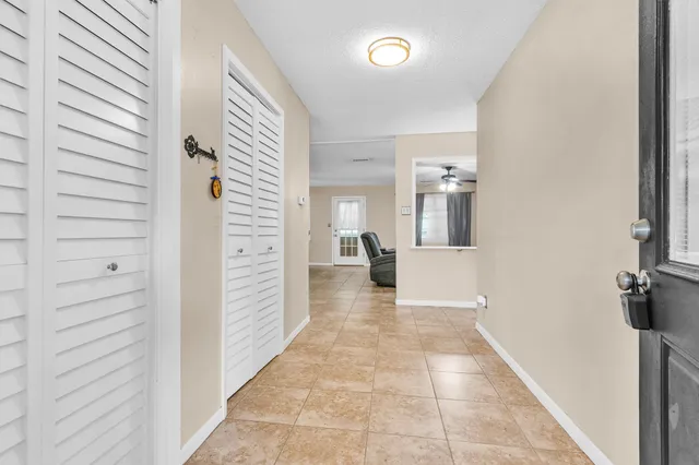 a view of a hallway view with staircase