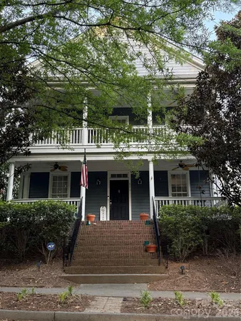 a view of house with yard