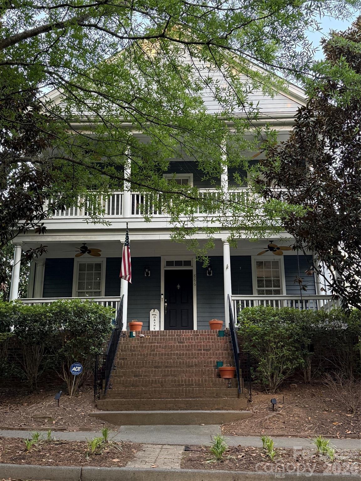 a view of house with yard
