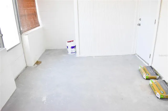 a view of storage and utility room with windows