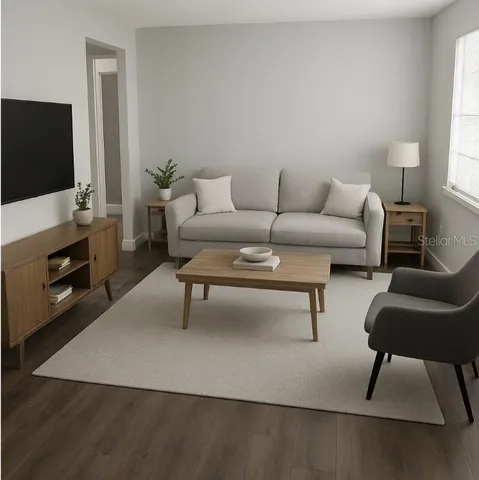 a living room with furniture and a flat screen tv