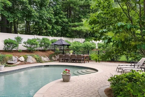 a view of swimming pool with a patio