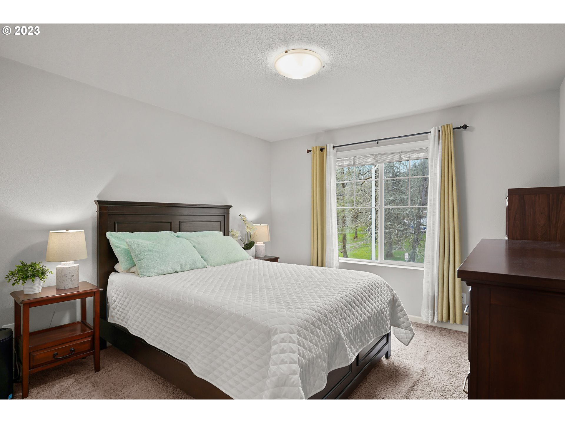 4189 Southwest Rodlun Road Gresham, OR 97080 - Photo 27 of 36 a bedroom with a bed and a window