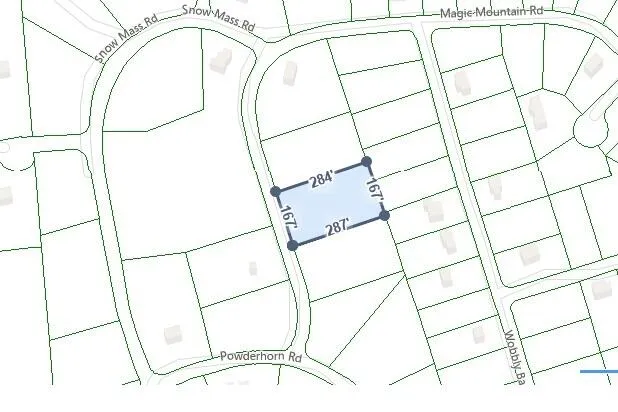 a picture of white walls with a window