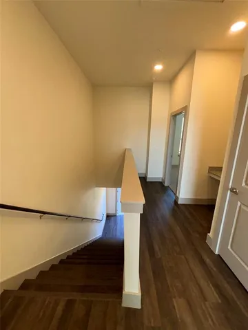 a view of front door with wooden floor