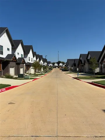 a view of street with houses
