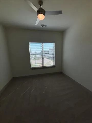 an empty room with a empty space and a window