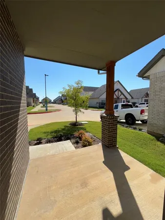 a front view of a house with a yard and a garage