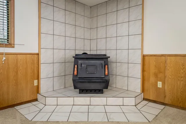 a kitchen with stainless steel appliances granite countertop a refrigerator and a stove