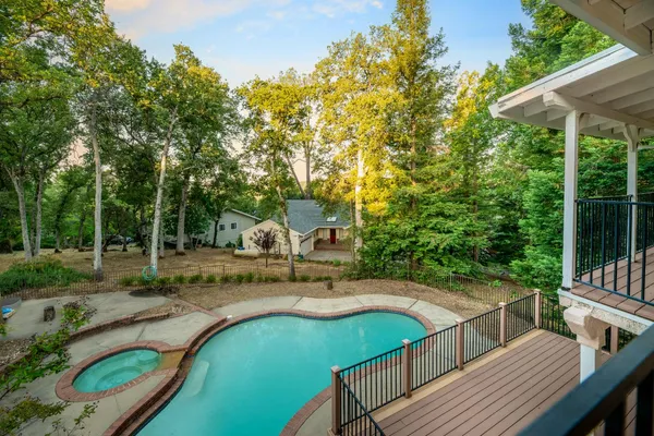 a bathroom with a granite countertop double vanity sink and mirror