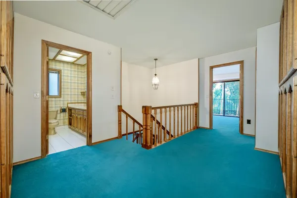 a bathroom with a double vanity sink and a toilet