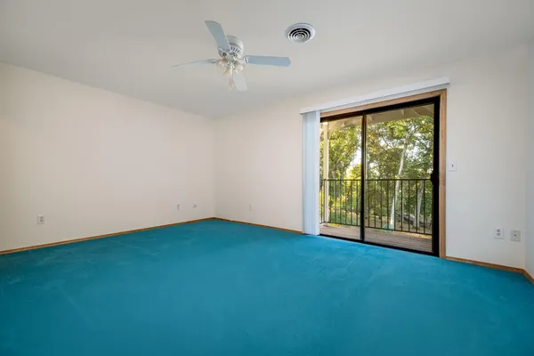 an aerial view of house with yard and outdoor seating
