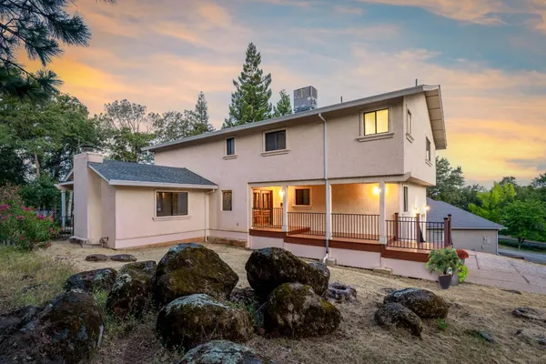 a balcony with wooden floor and outdoor space