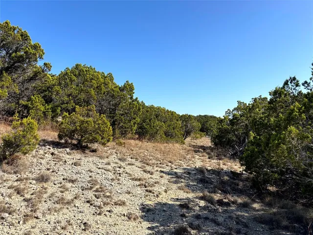 a view of a road with a mountain in the background