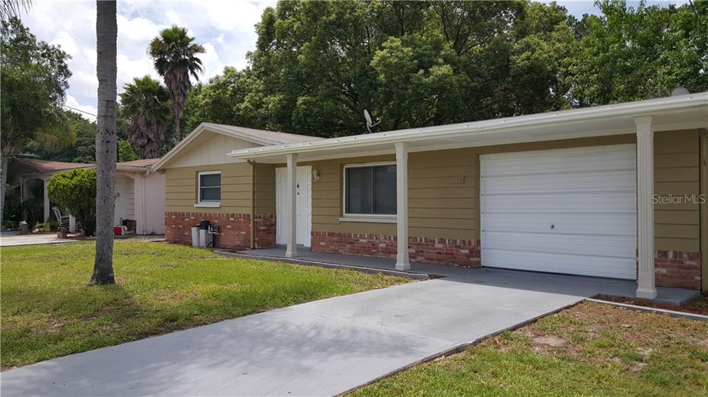 3736 Moog Road Holiday, FL 34691 - Photo 1 of 1 a view of a house with a backyard