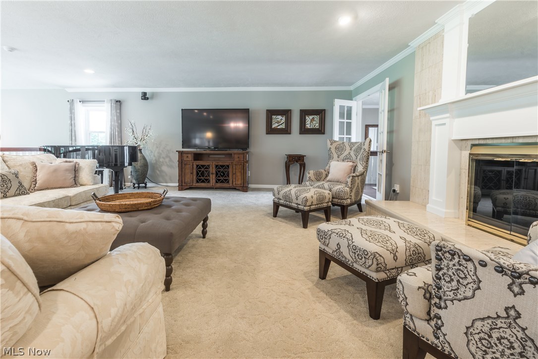 7510 Middle Ridge Road Madison, OH 44057 - Photo 6 of 35 Double-sided Gas Fireplace that warms the Living Room & Kitchen.