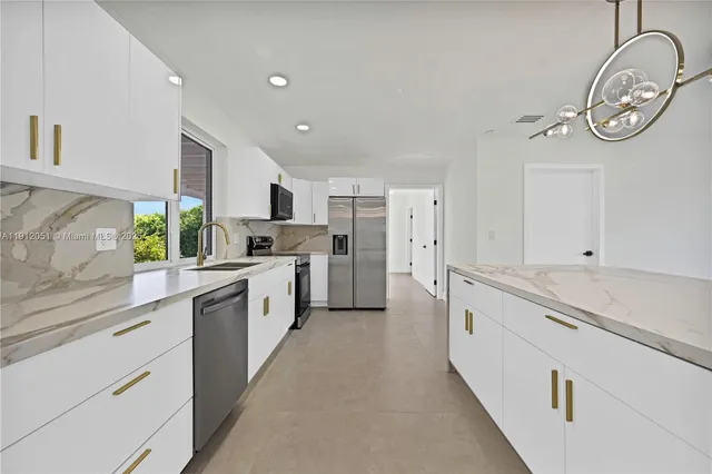 a large kitchen with a lot of counter top space