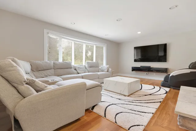a bedroom with furniture and a fireplace