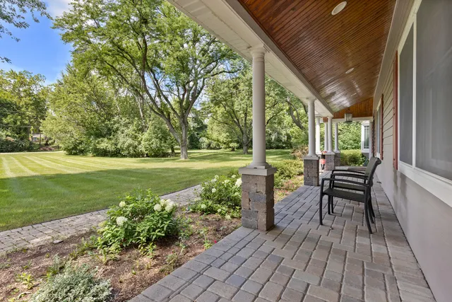 a view of a chair and tables in the garden