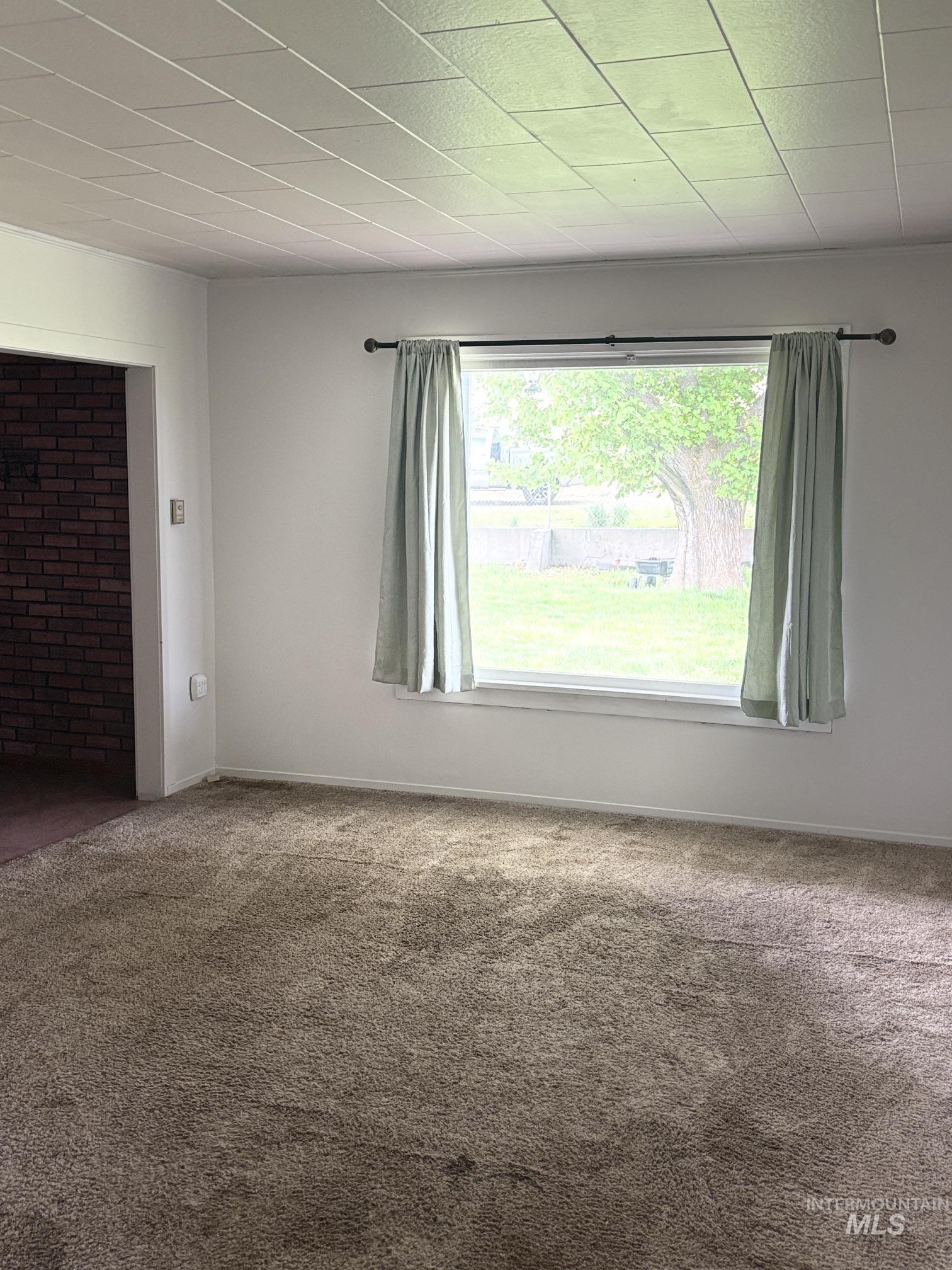 845 Malone Hill Road Pomeroy, WA 99347 - Photo 25 of 30 Neutral-toned wall-to-wall carpeting and white painted walls
