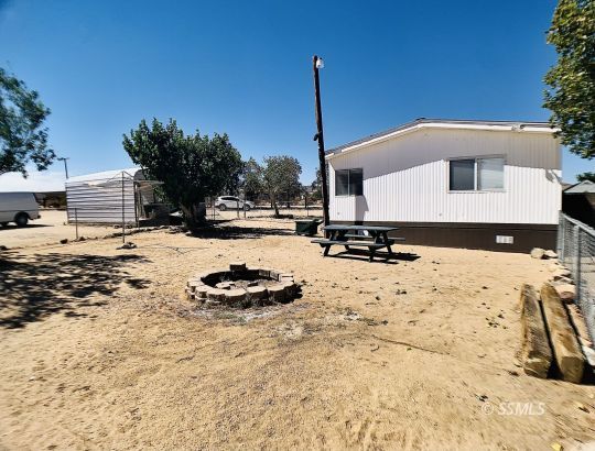 1370 Alpine Way Ridgecrest, CA 93555 - Photo 10 of 31 a front view of a house with a yard