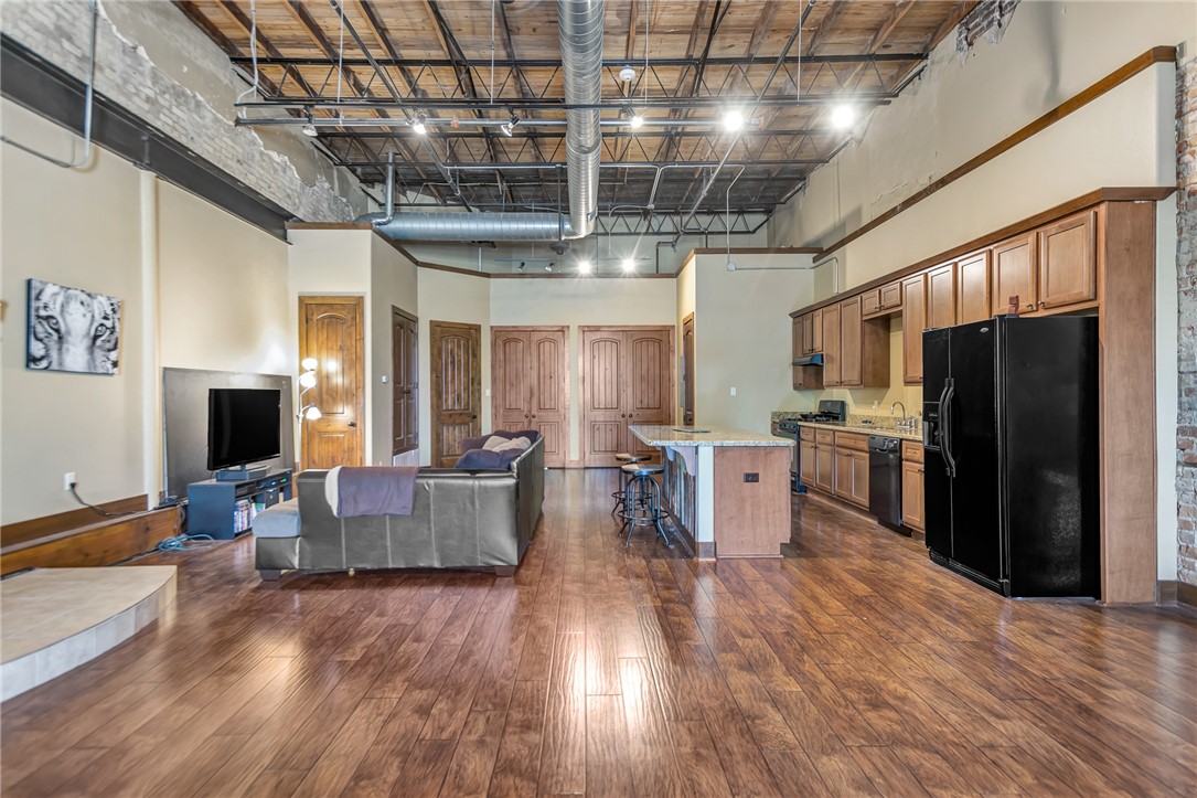 211 North Main Street, Unit 22 Bryan, TX 77803 - Photo 9 of 11 a large kitchen with lots of counter space and stainless steel appliances