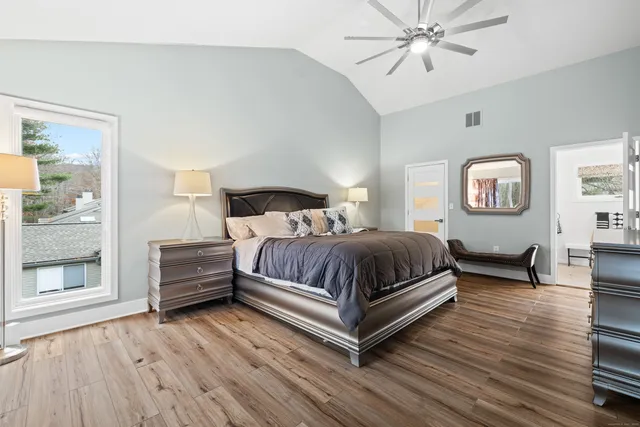 a bedroom with a bed and window