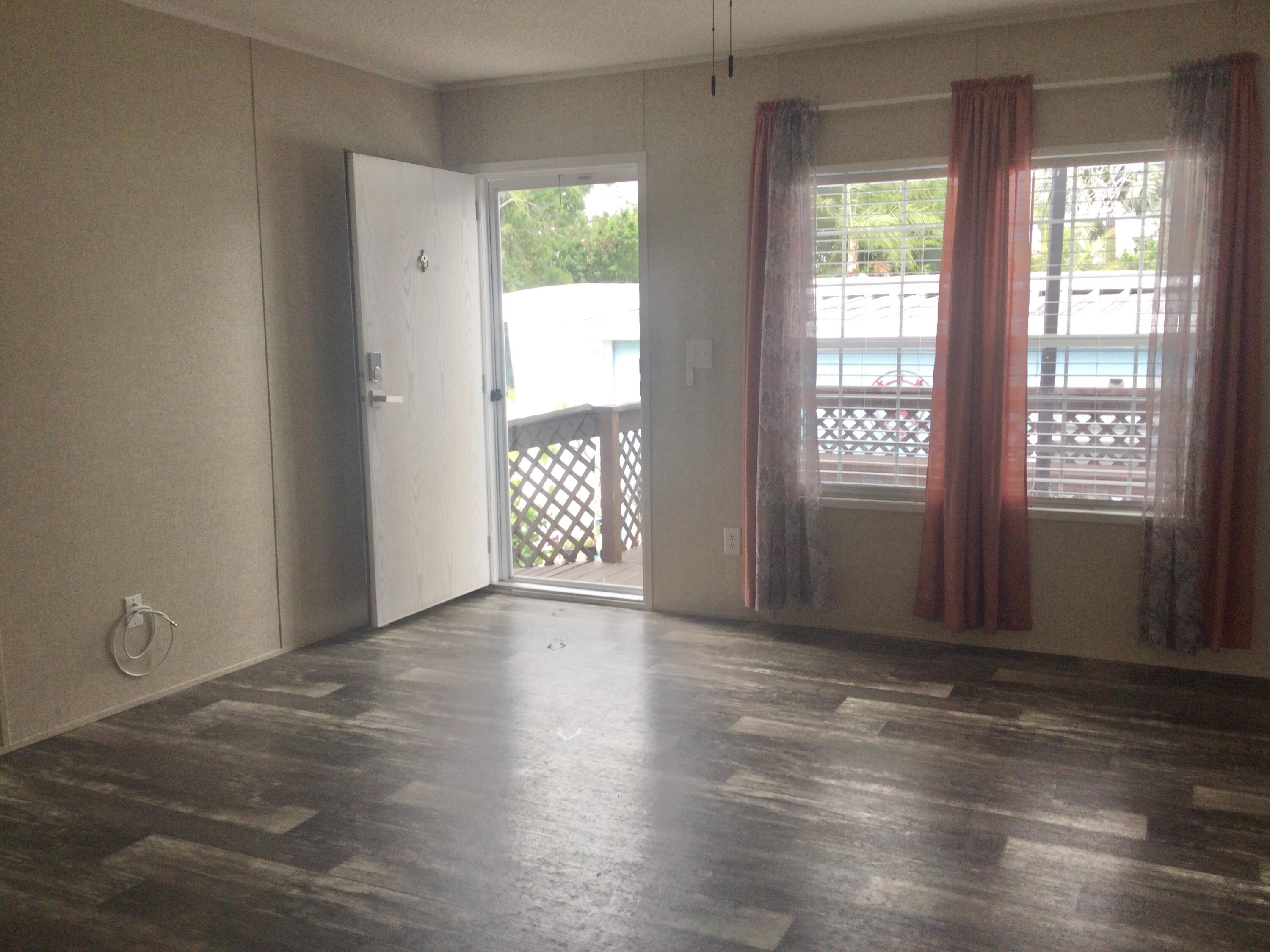 5000 Southeast Federal Highway, Unit 82 Stuart, FL 34997 - Photo 2 of 14 a view of an empty room with a window