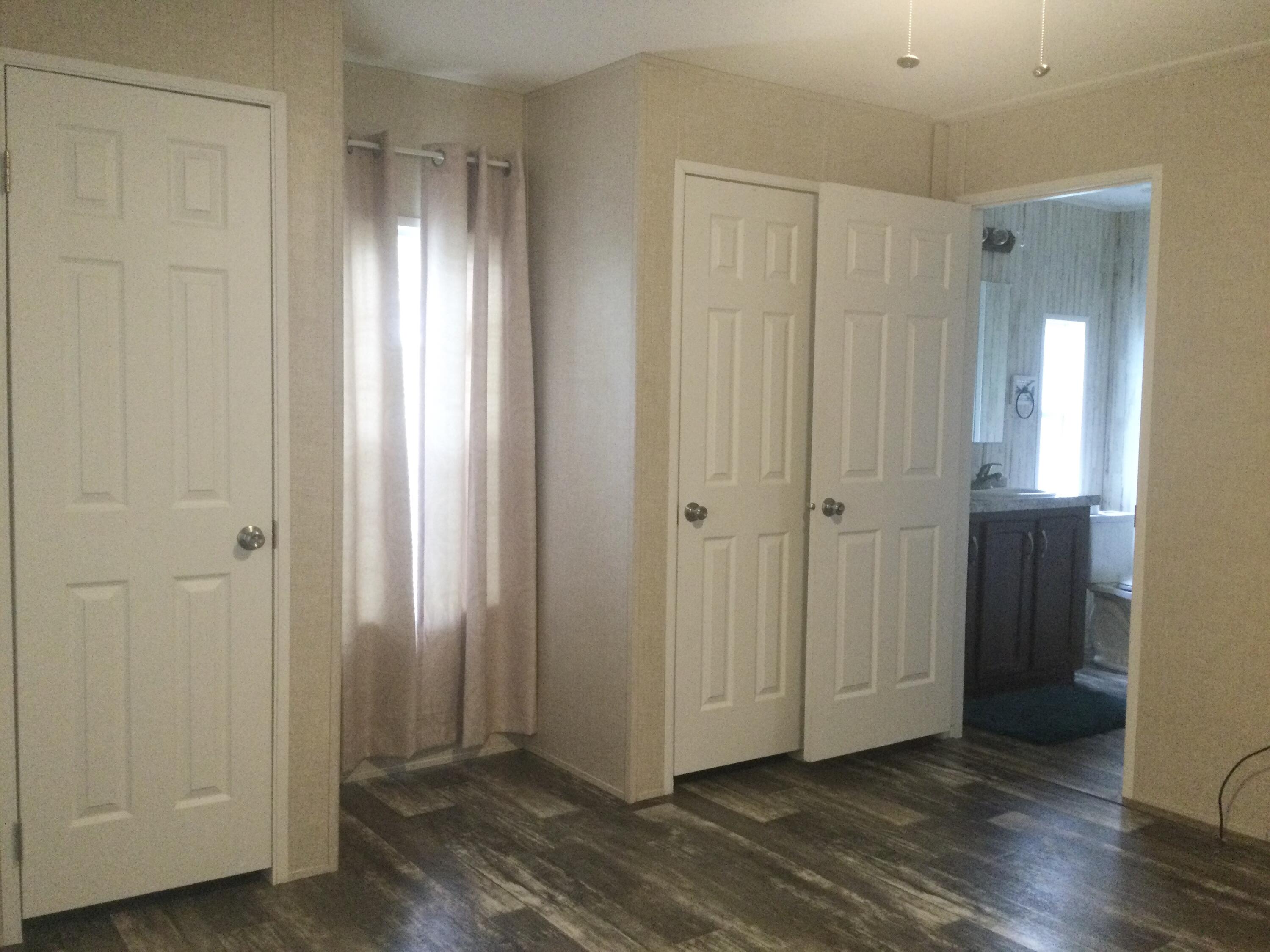 5000 Southeast Federal Highway, Unit 82 Stuart, FL 34997 - Photo 9 of 14 a view of entryway with wooden floor