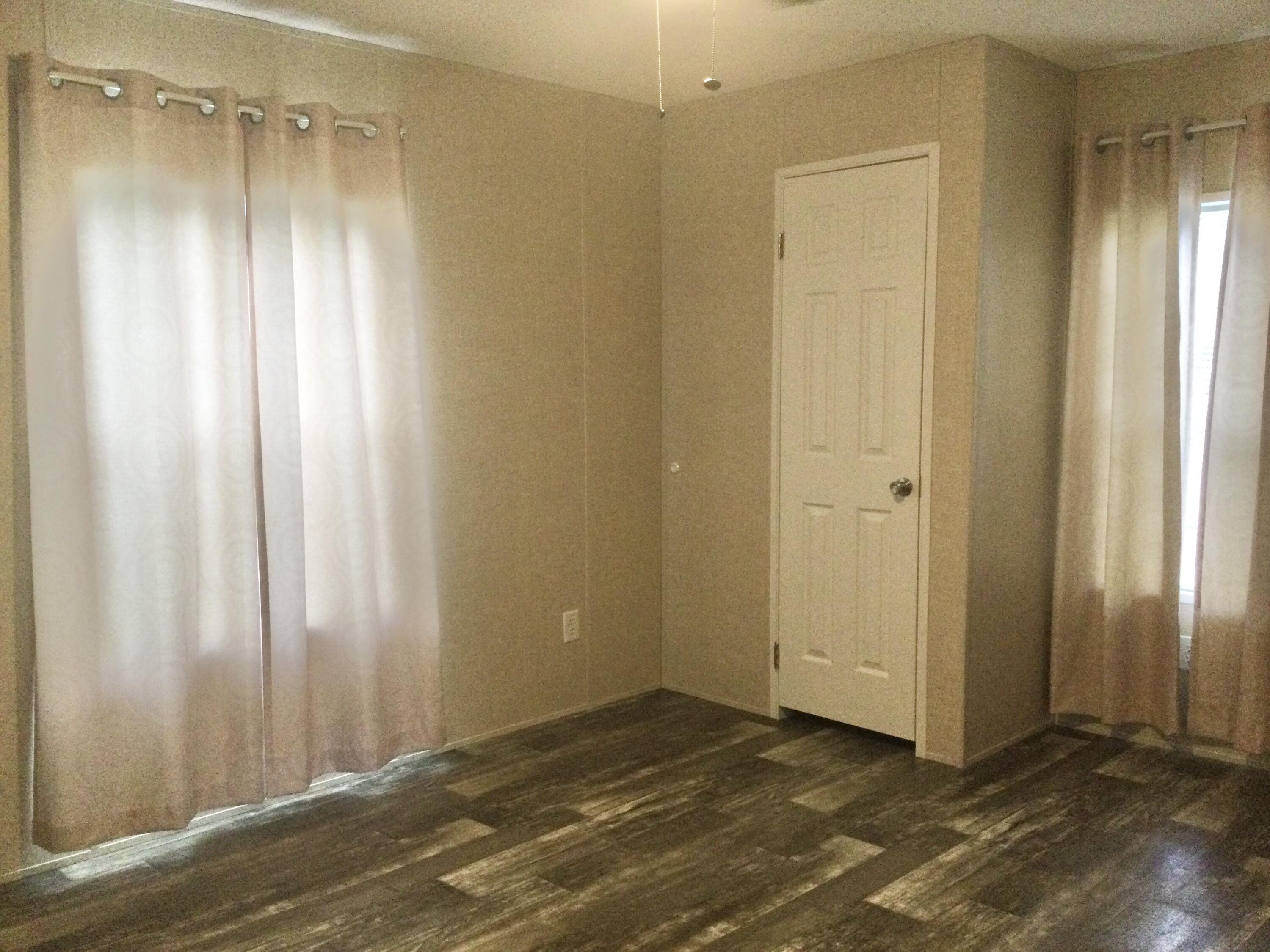 5000 Southeast Federal Highway, Unit 82 Stuart, FL 34997 - Photo 10 of 14 a view of a bathroom with wooden floor