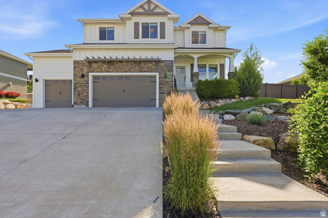 338 Windy Rdg Drive Smithfield, UT 84335 - Photo 3 of 63 Two-story residence featuring a mixed-material facade with stone accents and vertical siding