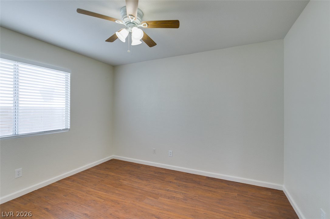 307 Cavalla Street Henderson, NV 89074 - Photo 30 of 44 A versatile room featuring wood flooring and a refreshing ceiling fan.