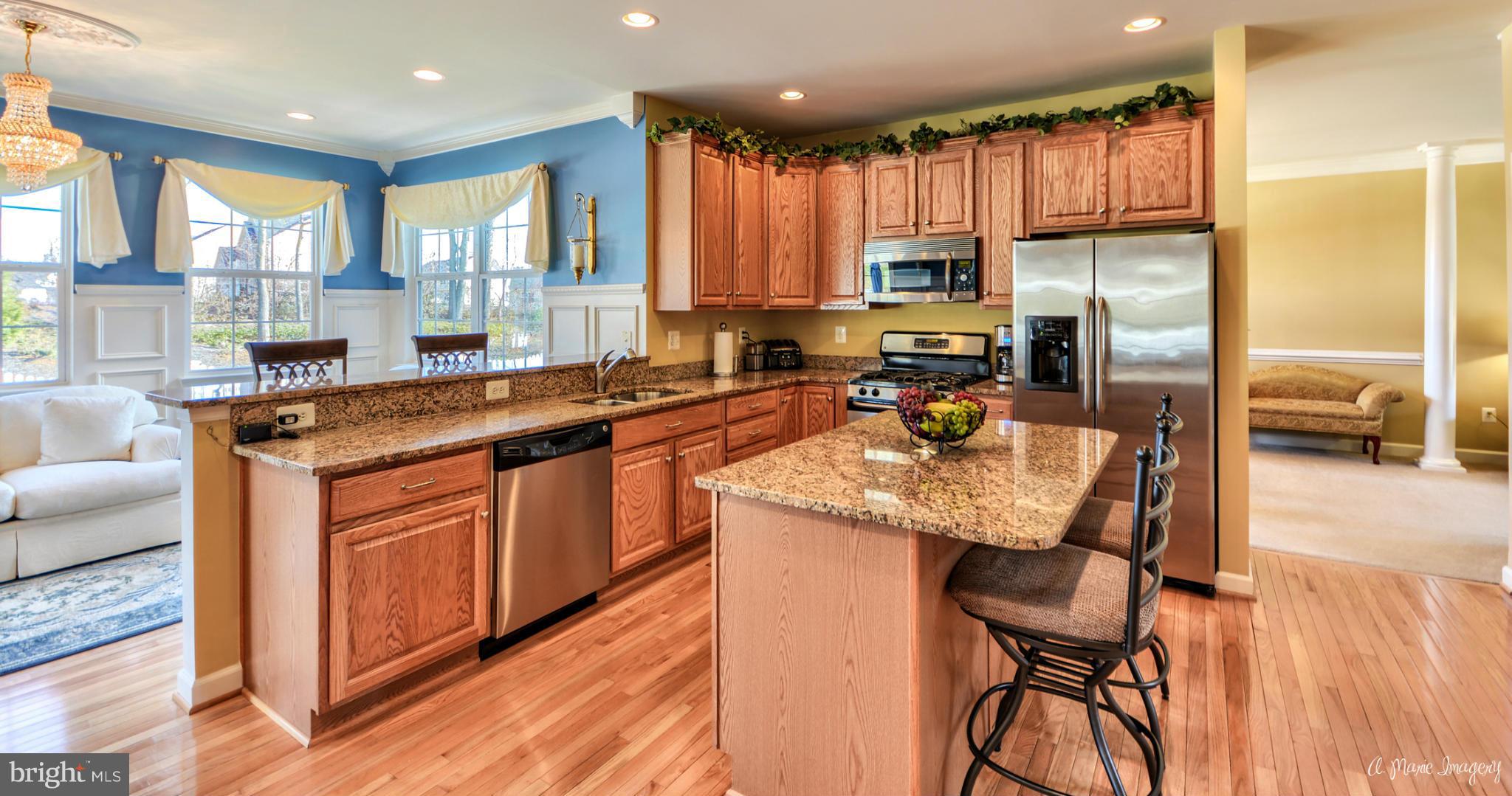 1719 Canal Clipper Court Point of Rocks, MD 21777 - Photo 11 of 30 a kitchen with stainless steel appliances granite countertop a stove a sink a refrigerator and island
