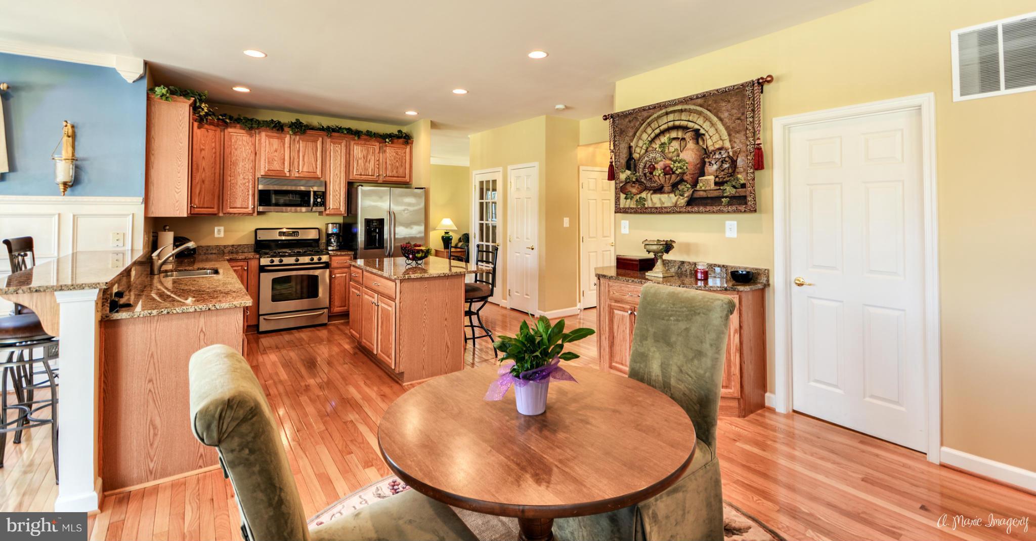 1719 Canal Clipper Court Point of Rocks, MD 21777 - Photo 12 of 30 a view of a dining room with furniture a kitchen and chandelier