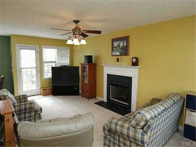 6 Round Spring Lane Durham, NC 27712 - Photo 2 of 12 Open Spacious Family Room has FP with Gas Logs, Ceiling Fan and Patio Door Leading to Large Deck