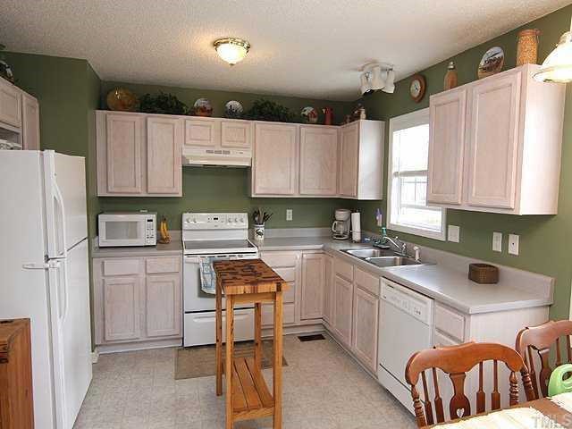 6 Round Spring Lane Durham, NC 27712 - Photo 5 of 12 Sunny Kitchen with Pickled Cabinets, Smooth Top Range, Pantry with Refrigerator Included!