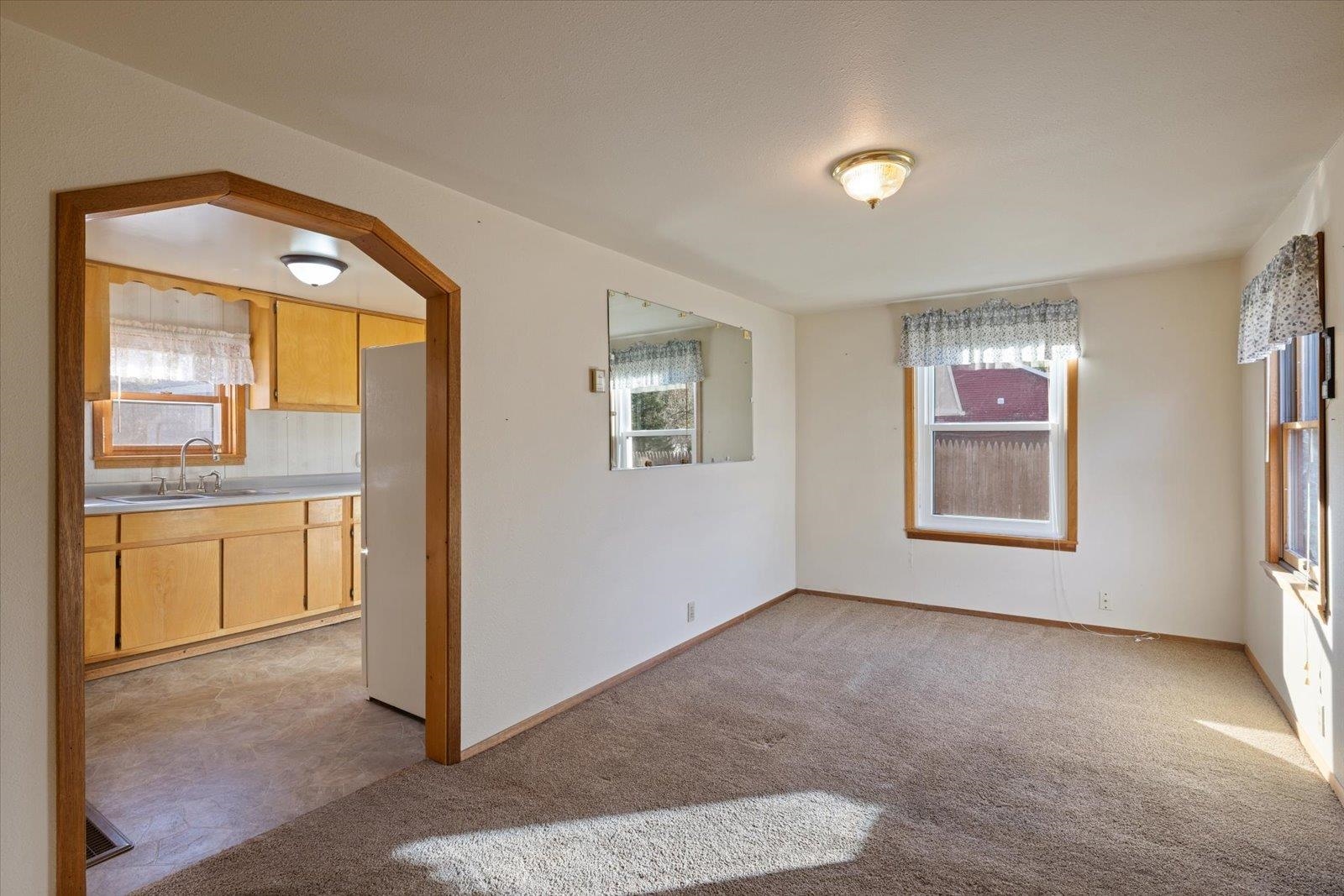 2120 Kelly Avenue Cloquet, MN 55720 - Photo 19 of 38 Spare room with light colored carpet and arched walkways