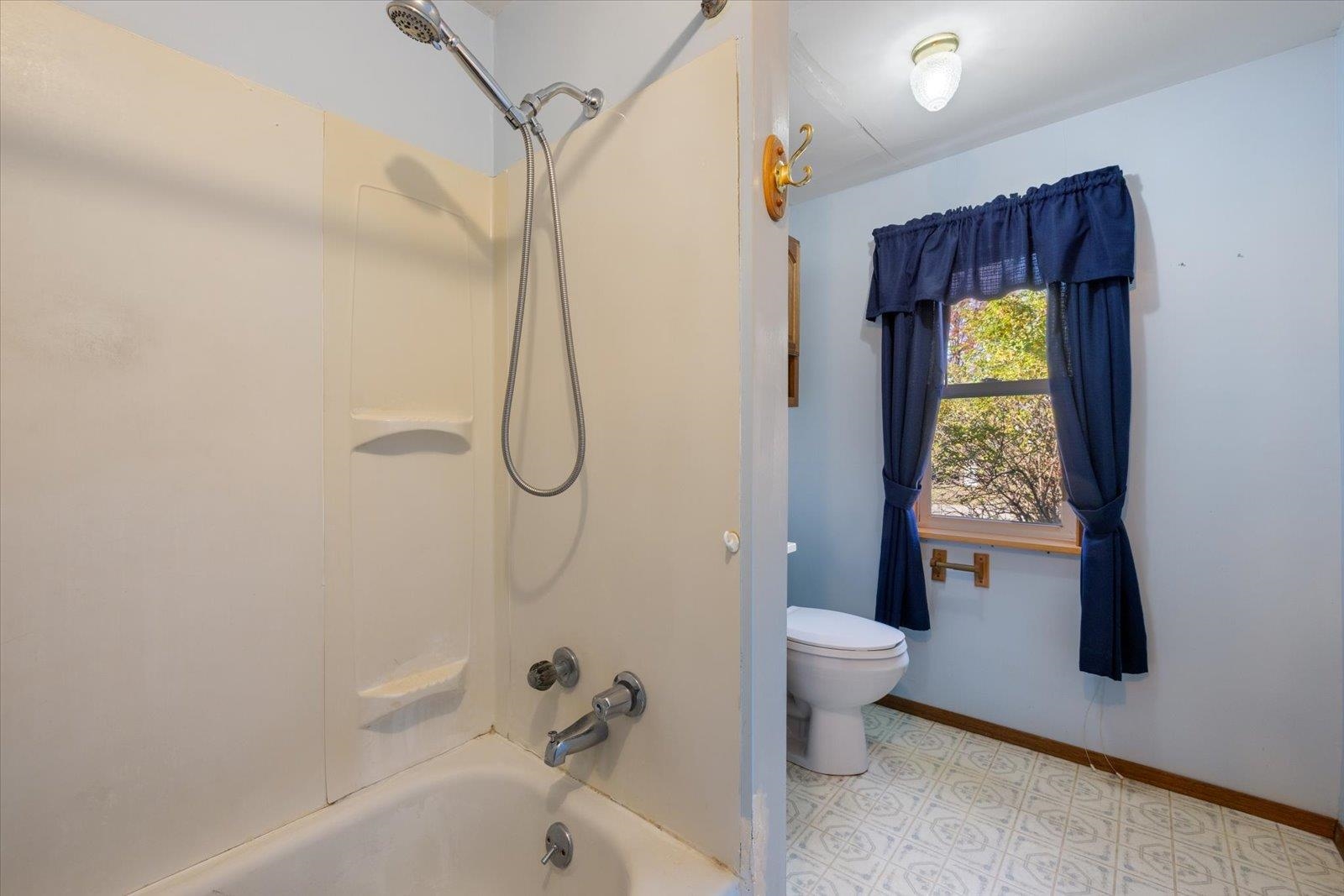 2120 Kelly Avenue Cloquet, MN 55720 - Photo 27 of 38 Bathroom featuring shower / washtub combination and toilet