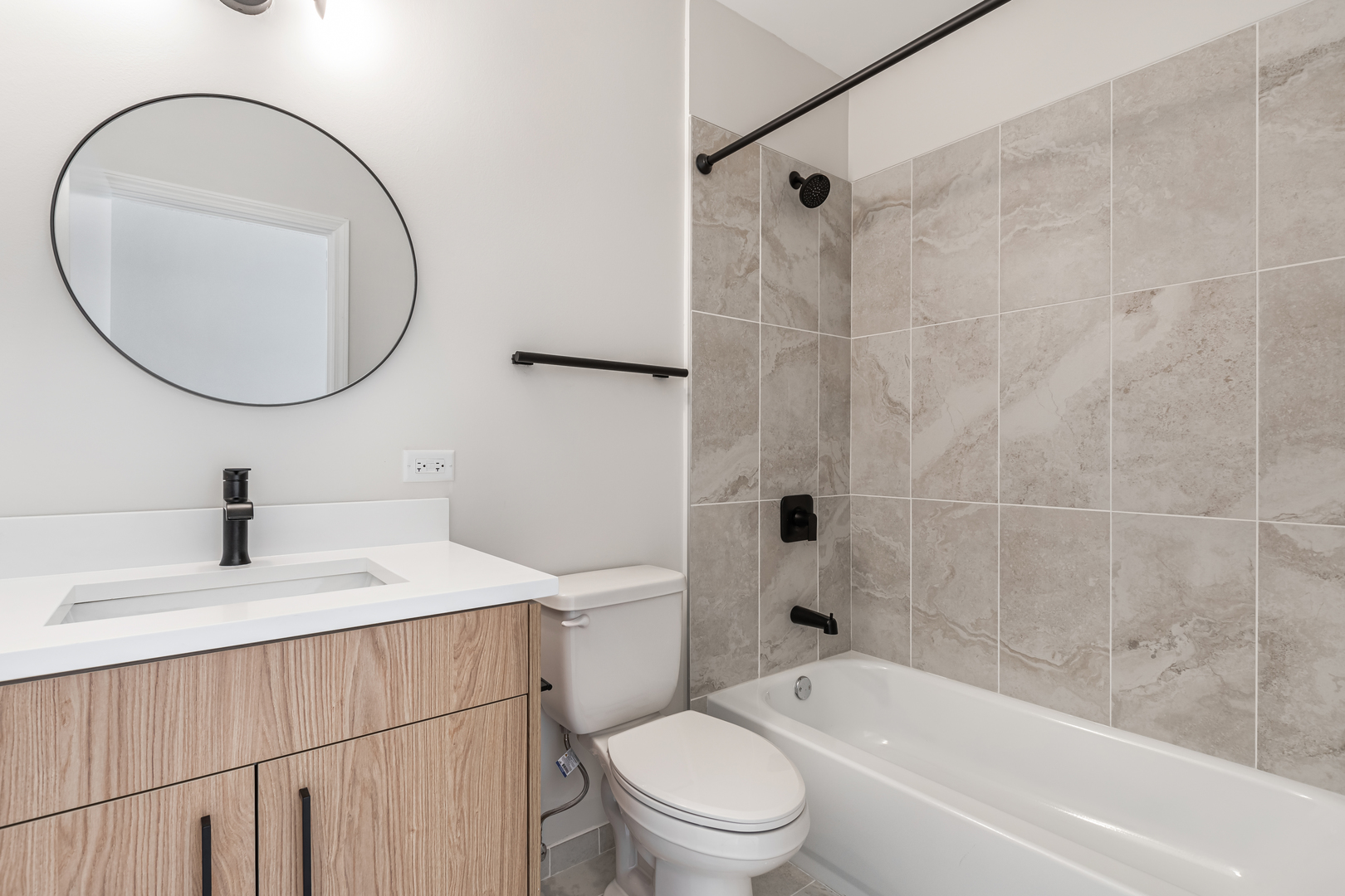 805 North Milwaukee Avenue, Unit 2S Chicago, IL 60642 - Photo 15 of 29 a bathroom with a sink a toilet and a mirror