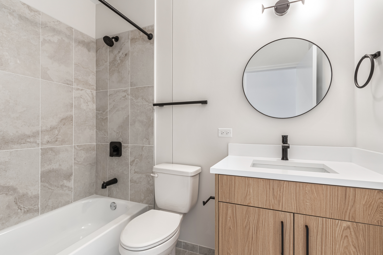 805 North Milwaukee Avenue, Unit 2S Chicago, IL 60642 - Photo 19 of 29 a bathroom with a sink a toilet and a mirror