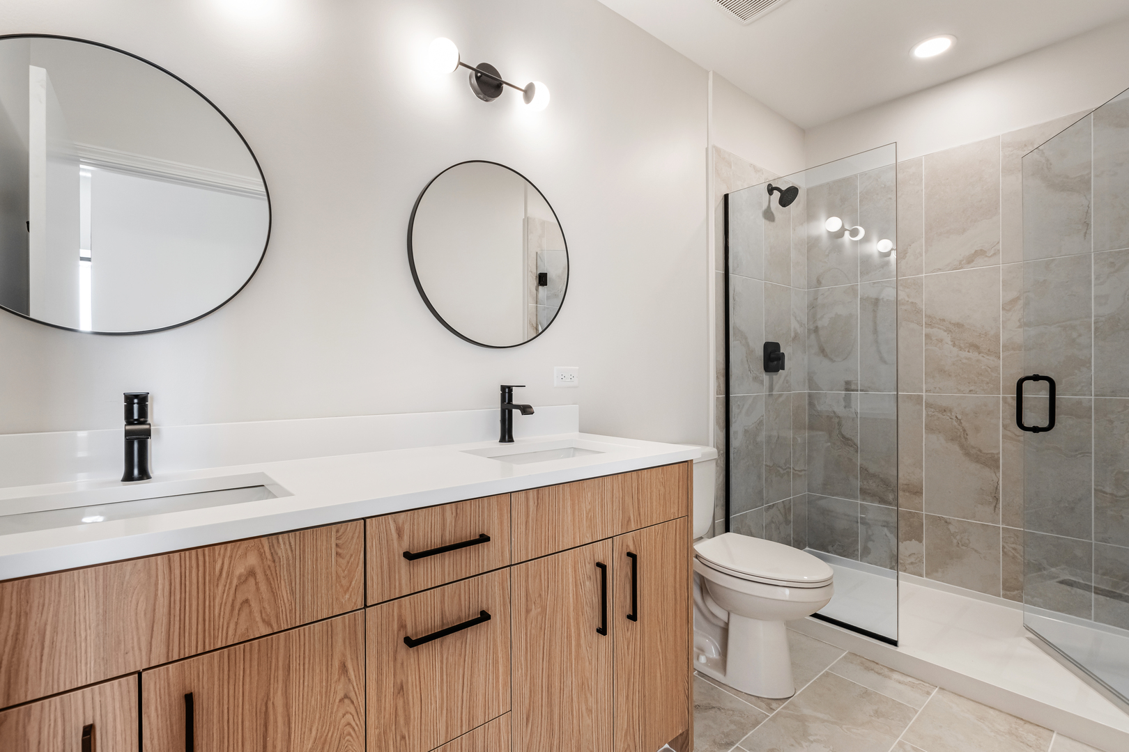 805 North Milwaukee Avenue, Unit 2S Chicago, IL 60642 - Photo 24 of 29 a bathroom with a toilet a sink and mirror