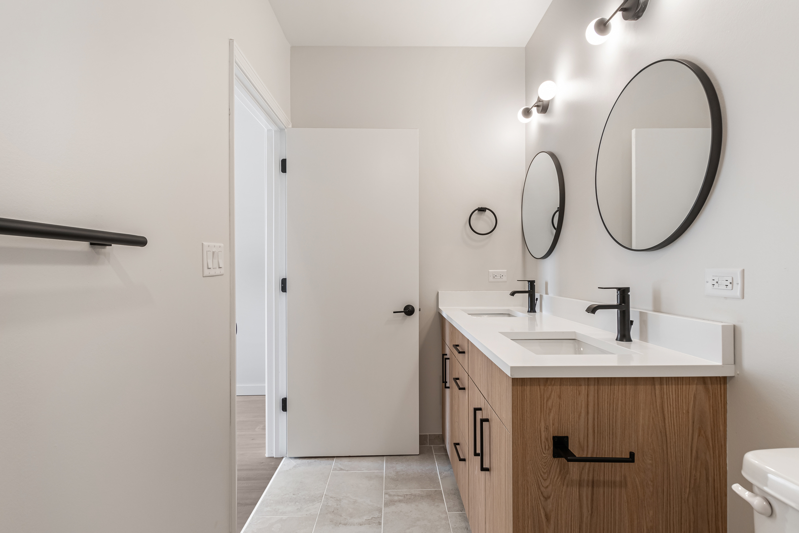 805 North Milwaukee Avenue, Unit 2S Chicago, IL 60642 - Photo 25 of 29 a bathroom with a sink and a mirror