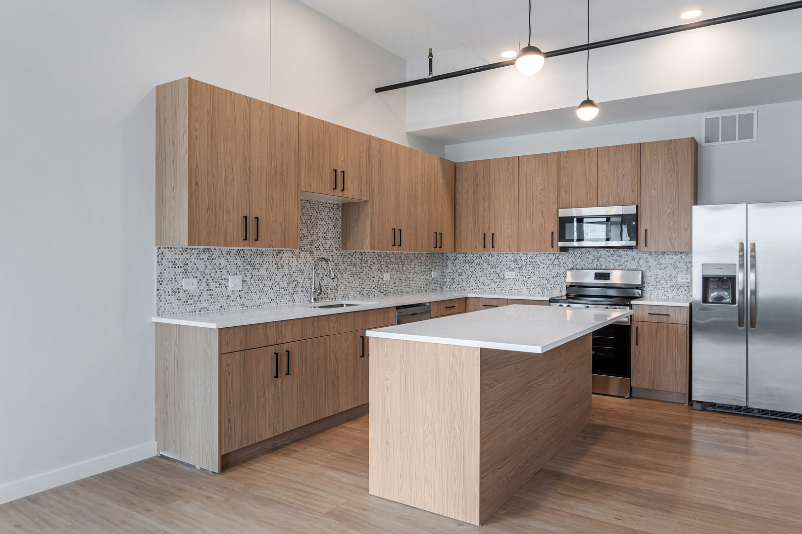805 North Milwaukee Avenue, Unit 2S Chicago, IL 60642 - Photo 6 of 29 a kitchen with stainless steel appliances granite countertop a sink stove and refrigerator