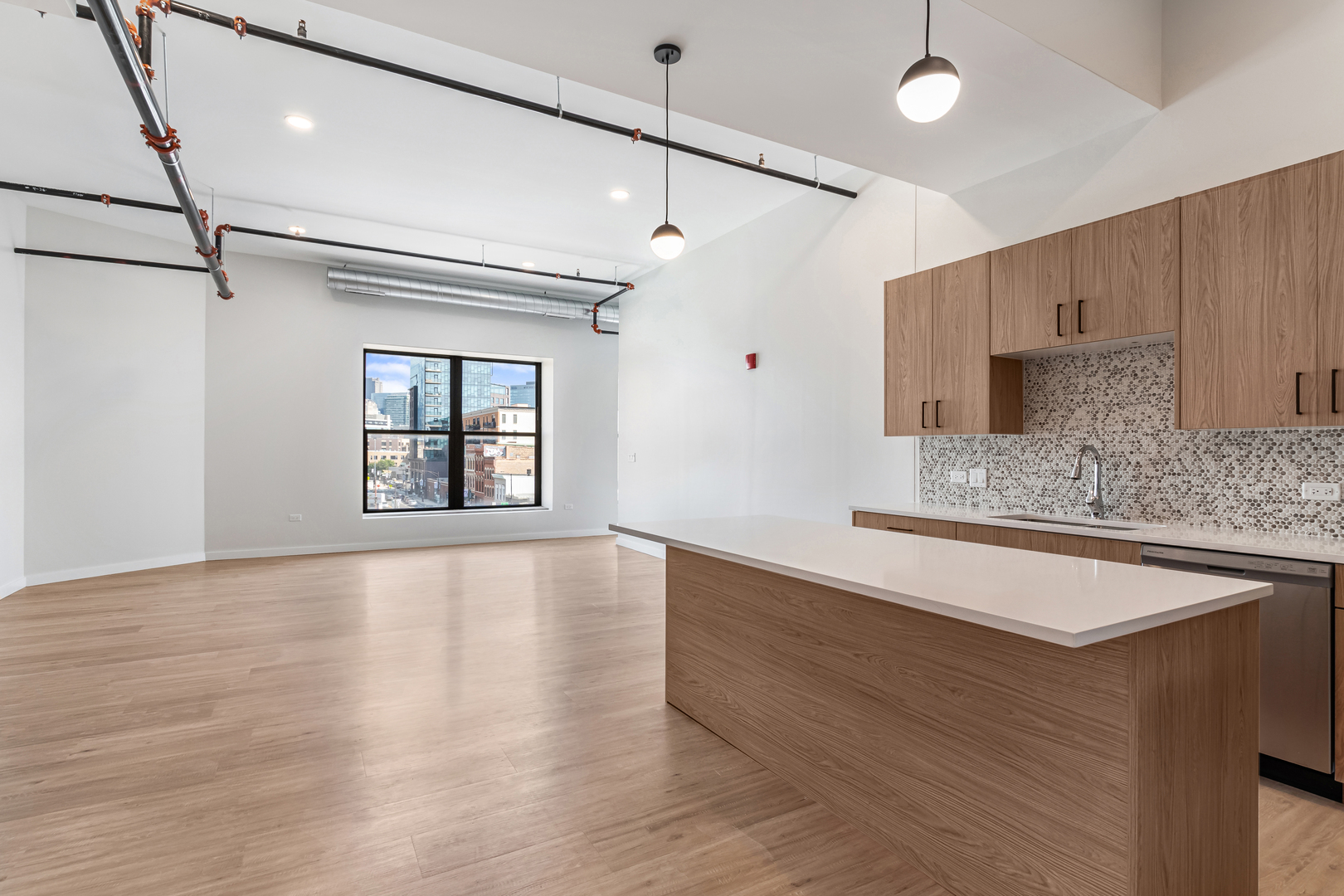 805 North Milwaukee Avenue, Unit 2S Chicago, IL 60642 - Photo 8 of 29 a view of an empty room with window and wooden floor